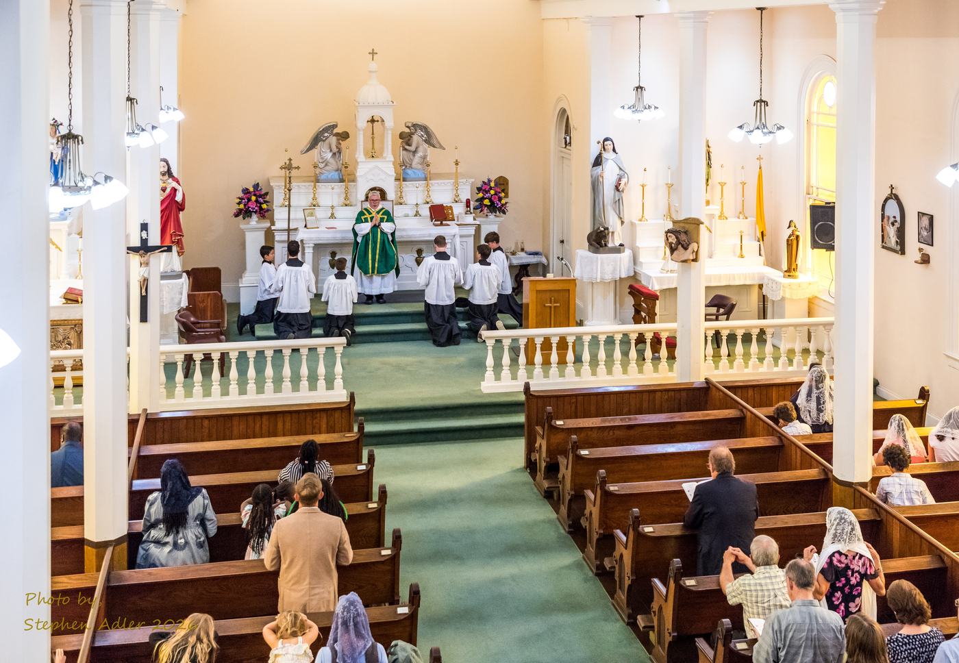 The congregation at Mass, seen from the back of the church