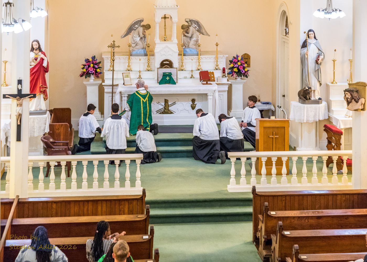 The faithful kneeling during Mass
