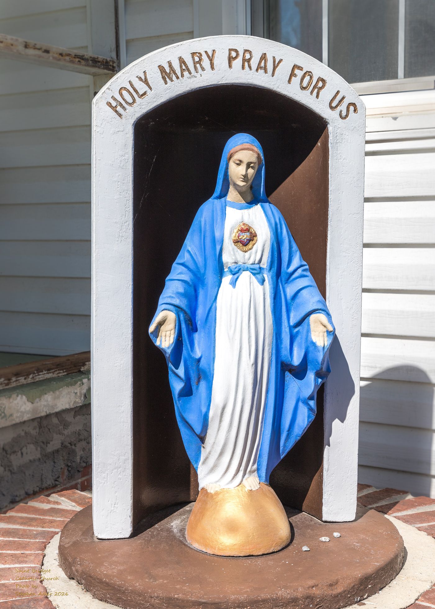 A statue of the Blessed Virgin Mary on the church grounds